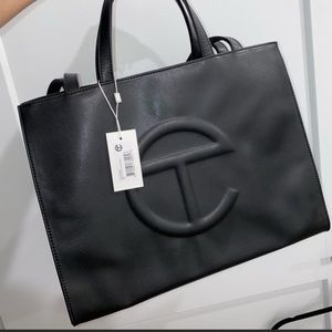 Authentic brand new, still in packaging Black Telfar bag!
